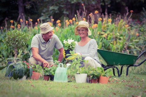 Gardener measuring a backyard in Hackbridge for a quote